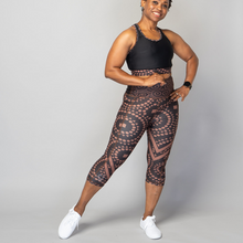 Load image into Gallery viewer, Signature Splash Capri Leggings – TYNA brown cropped gym leggings with triangle, square and circle motifs
