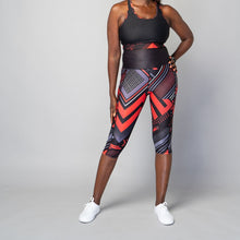 Load image into Gallery viewer, TYNA Soko Ankara Red Capris – women’s cropped gym leggings with red and black Ankara print