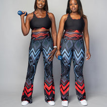 Load image into Gallery viewer, Soko Ankara Red flared leggings with bold African print design
